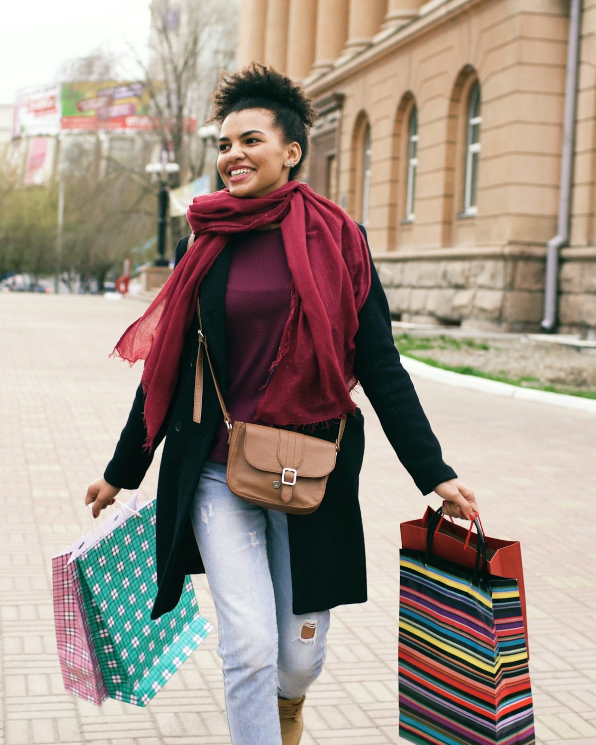 Nigerian shopper carrying shopping bags